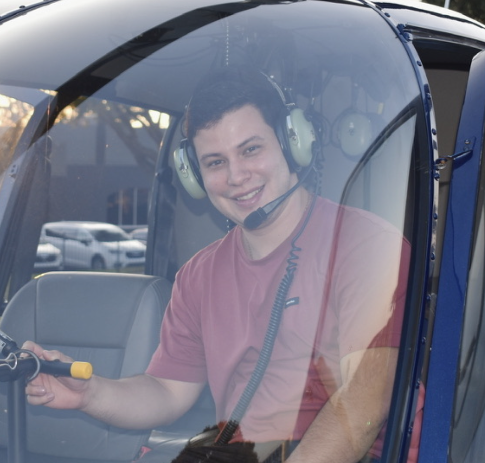 Cleibert Mora inside a helicopter cockpit